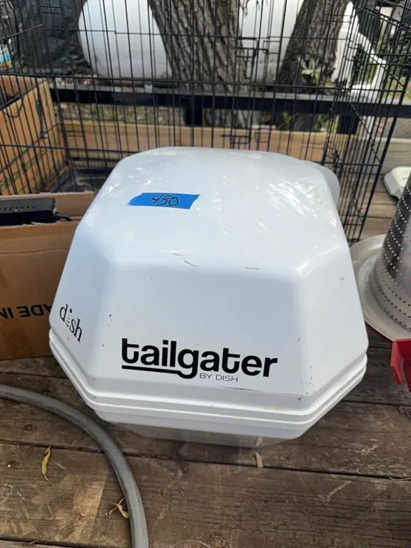 Tailgater portable dish for portable tv, complete with books, remote, etc.