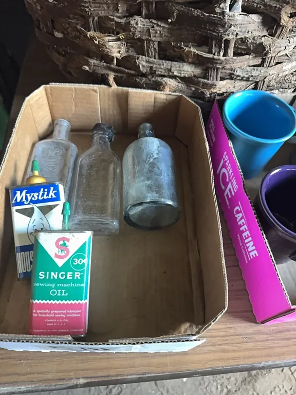 Antique bottles and oil cans