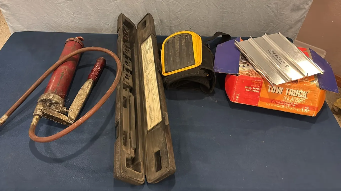 Grease gun, knee pads, grippers, and parts of service kit