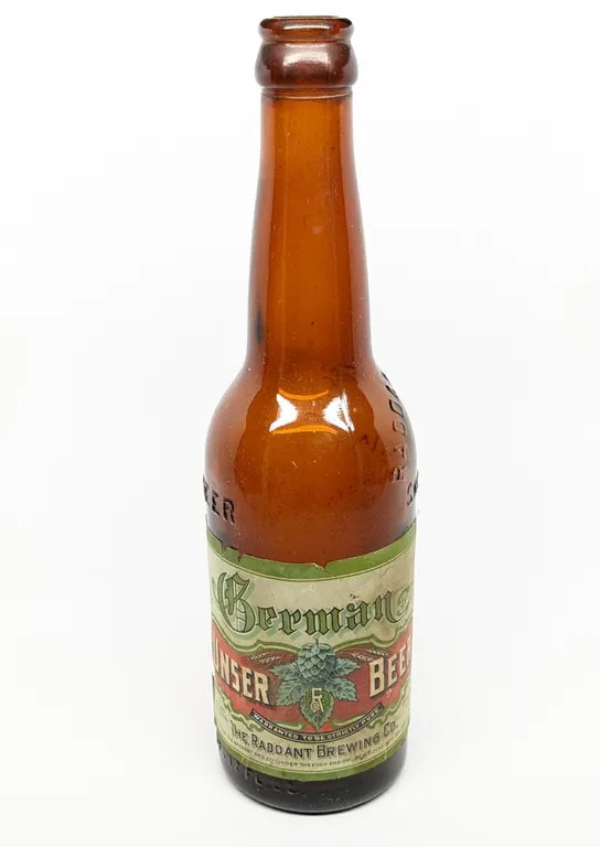 PRE PROHIBITION 12 OZ PAPER LABEL BOTTLE GERMAN UNSER BEER THE RADDANT BREWING CO SHAWANO WISCONSIN