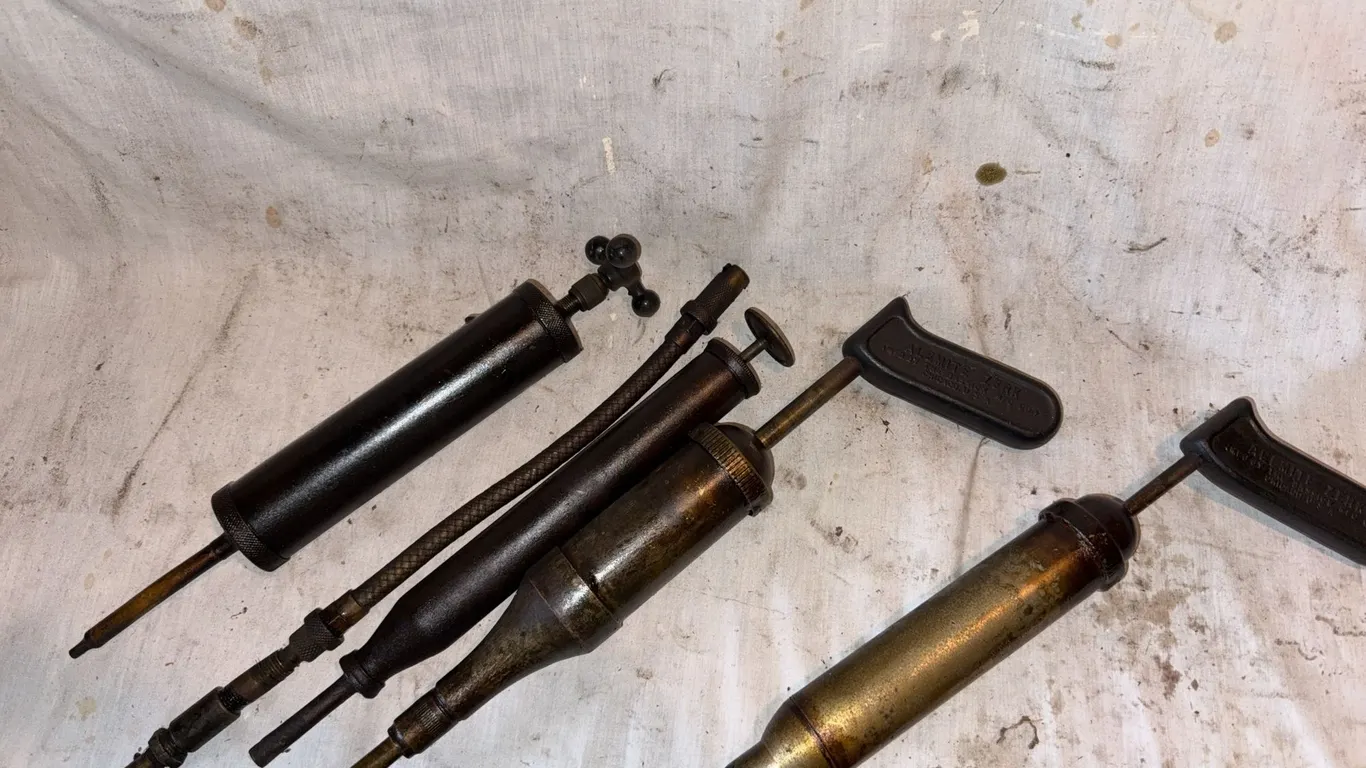 A lot of vintage grease guns