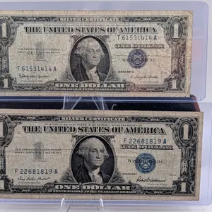 $1 Silver Certificate Lot – Series 1957 & 1957B Blue Seals – Circulated Duo – In Protective Sleeves