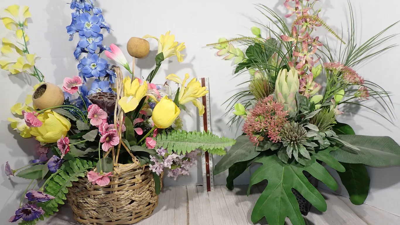 Decorative Artificial Floral Arrangements in Woven Basket and Embossed Planter - 2-Piece Lot