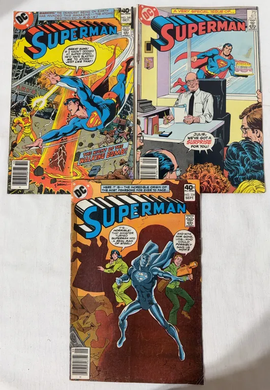 Three Superman comics. #339, 340 and 411.