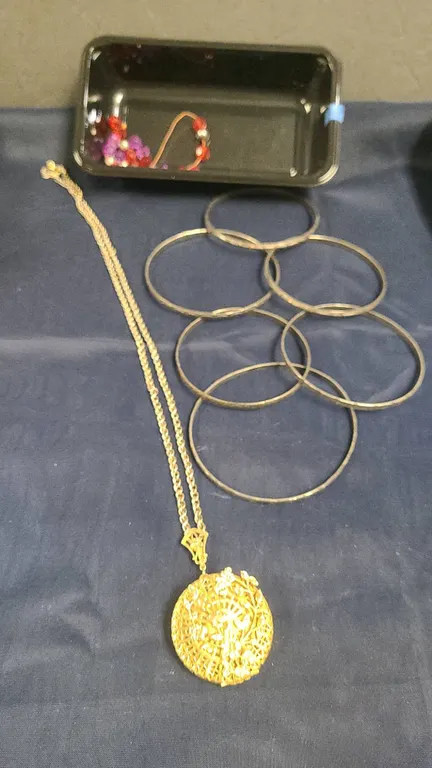 Jewelry Lot Including Gold-Tone Filigree Locket Necklace, Six Metal Bangles, and Beaded Items, No Me