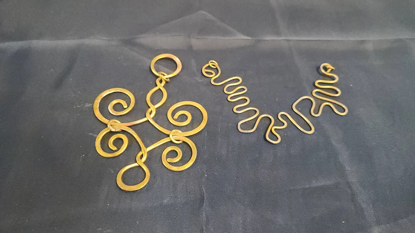 Gold-Tone Necklace Pendants and Connectors, Missing Chains, Two Cubic storage containers.