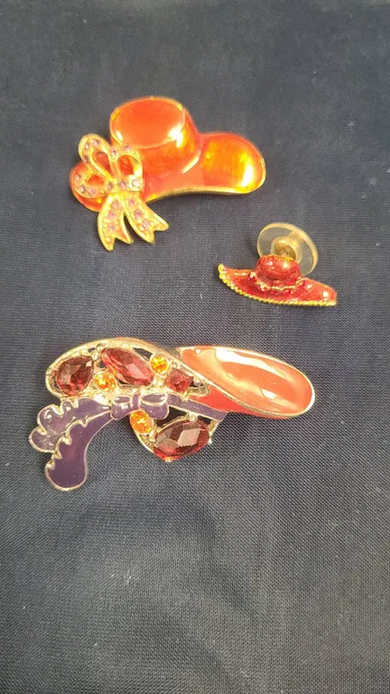 Three Gold-Tone Enamel and Rhinestone Hat Brooches and Pin Featuring Red and Purple Accents, Assorte