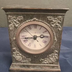 Howard Miller Decorative Quartz Mantel Clock with Ornate Relief Detailing and Roman Numerals Dial Fa
