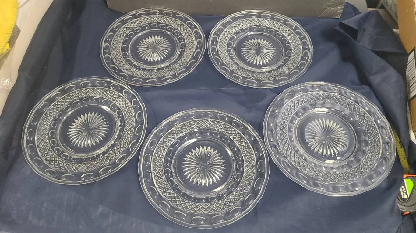 Five Clear Pressed Glass Plates with Geometric and Sunburst Patterns, Circular Motifs Throughout