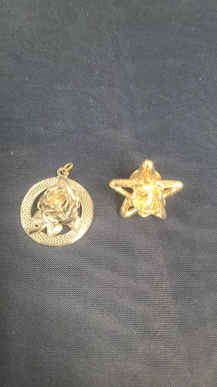 Two Gold Tone Jewelry Pieces: Rose Motif Circular Pendant and Star Lapel Pin with Crystal Centerpiec