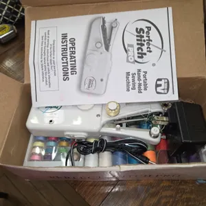 Portable handheld sewing machine