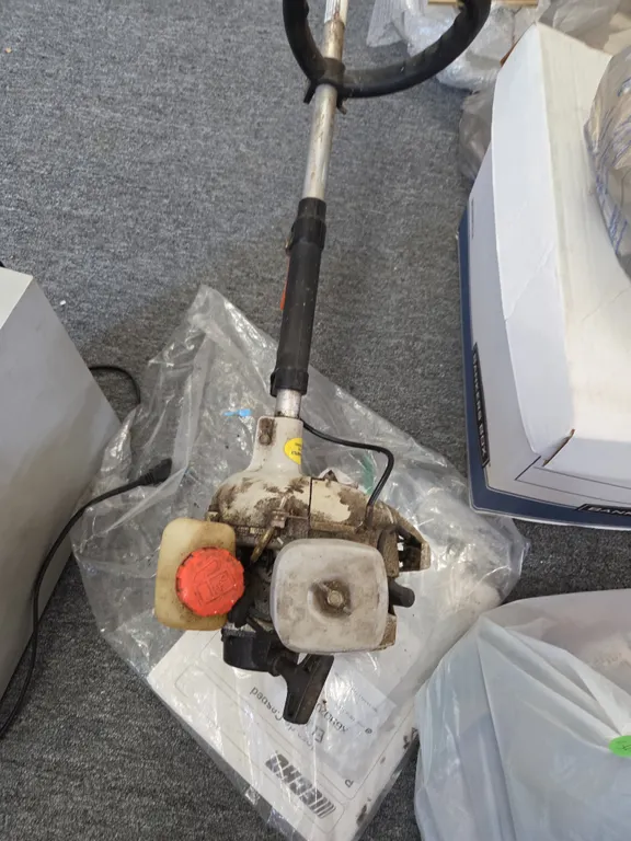 Gas weed wacker with spare carburetor