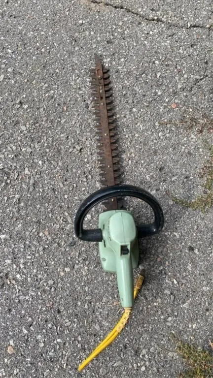 Hedge trimmers working