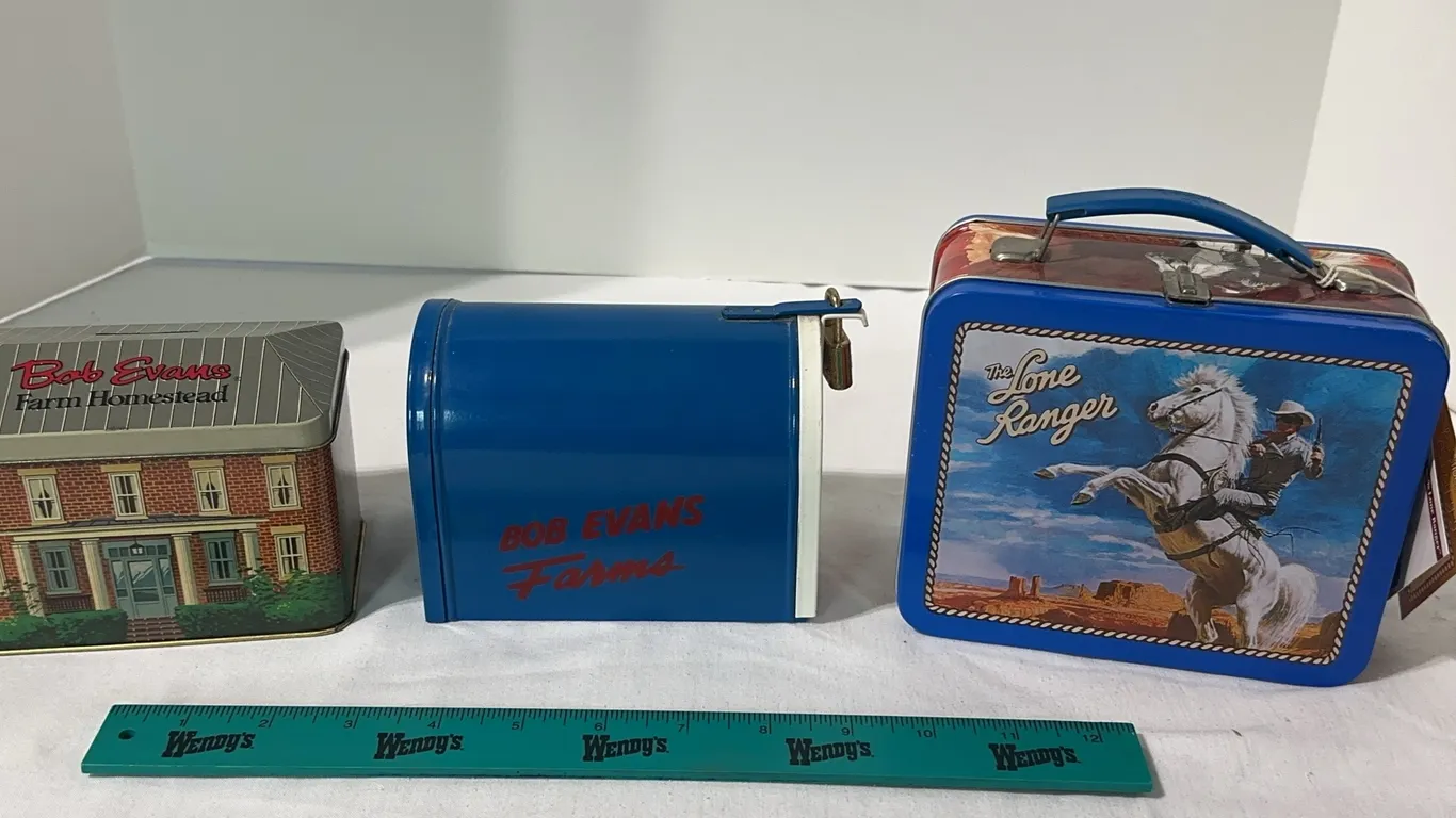 Lot of 3 tins. Two are Bob Evans banks and one is a Lone Ranger miniature lunchbox