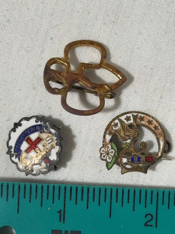 Three vintage pins