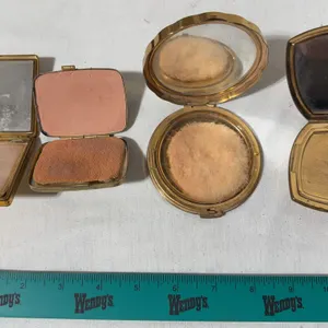 Four different gold, toned, metal  mirror/powder compacts
