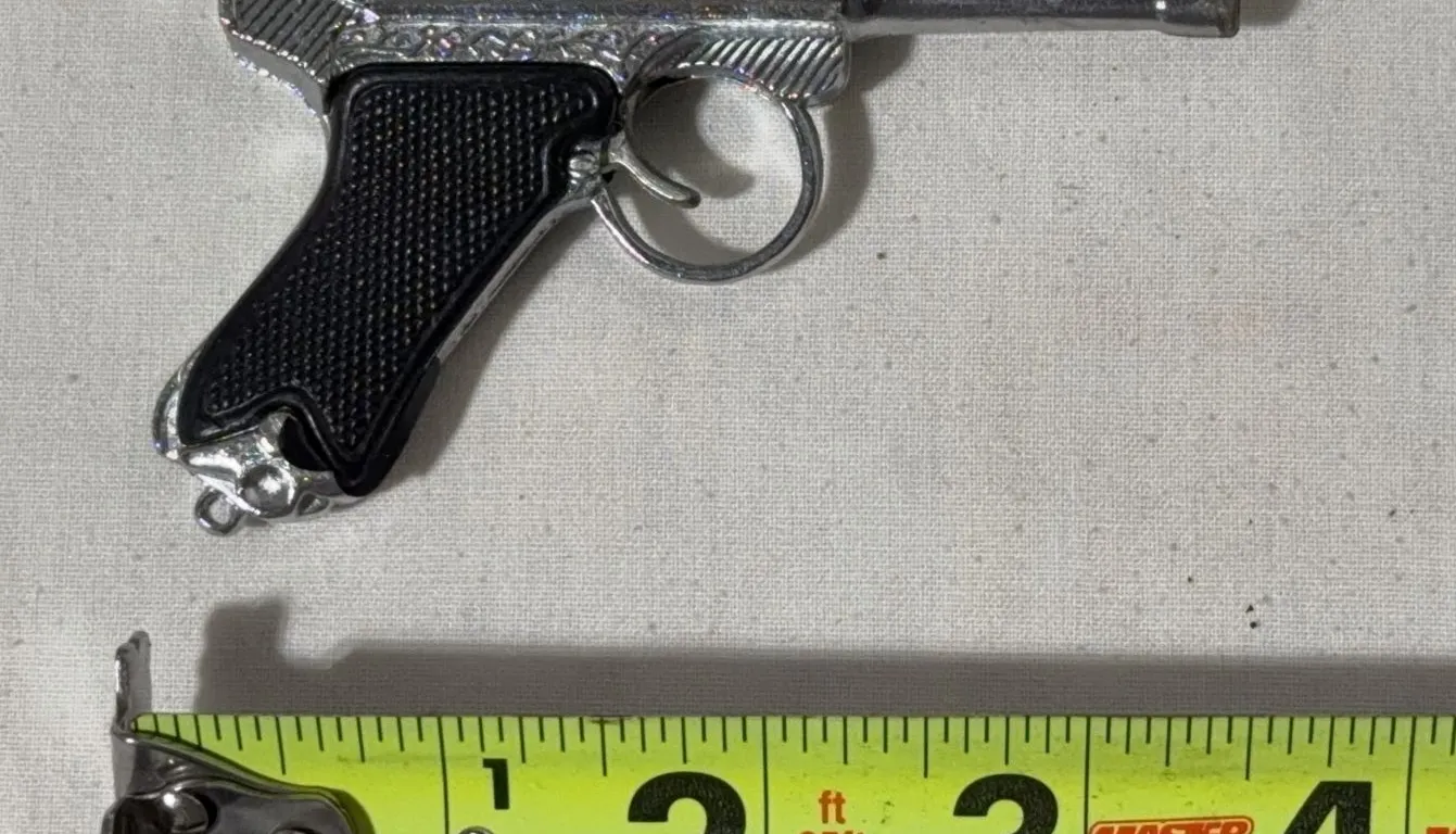 Vintage miniature die-cast toy replica of a German Luger P08 pistol