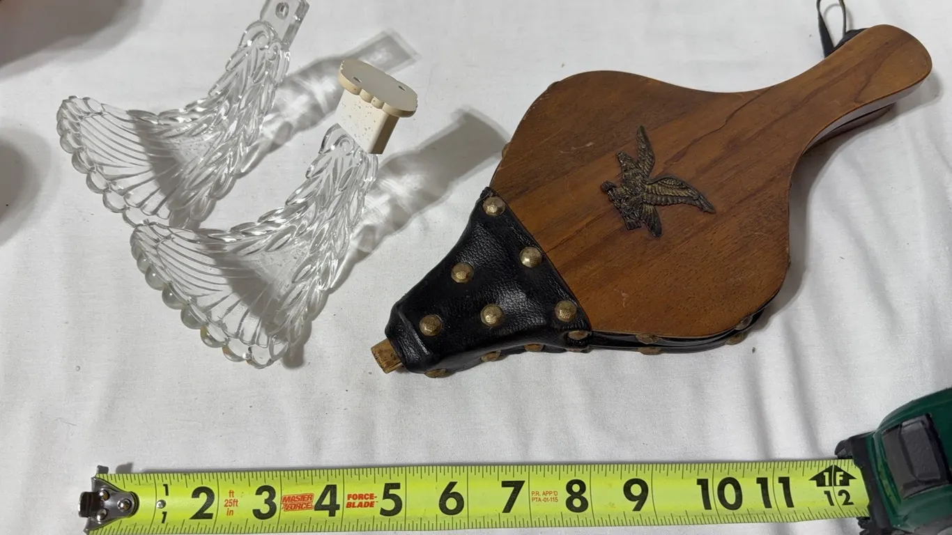 Vintage glass leaf drapery curtain tie-backs and a vintage wood and black leather fireplace bellows
