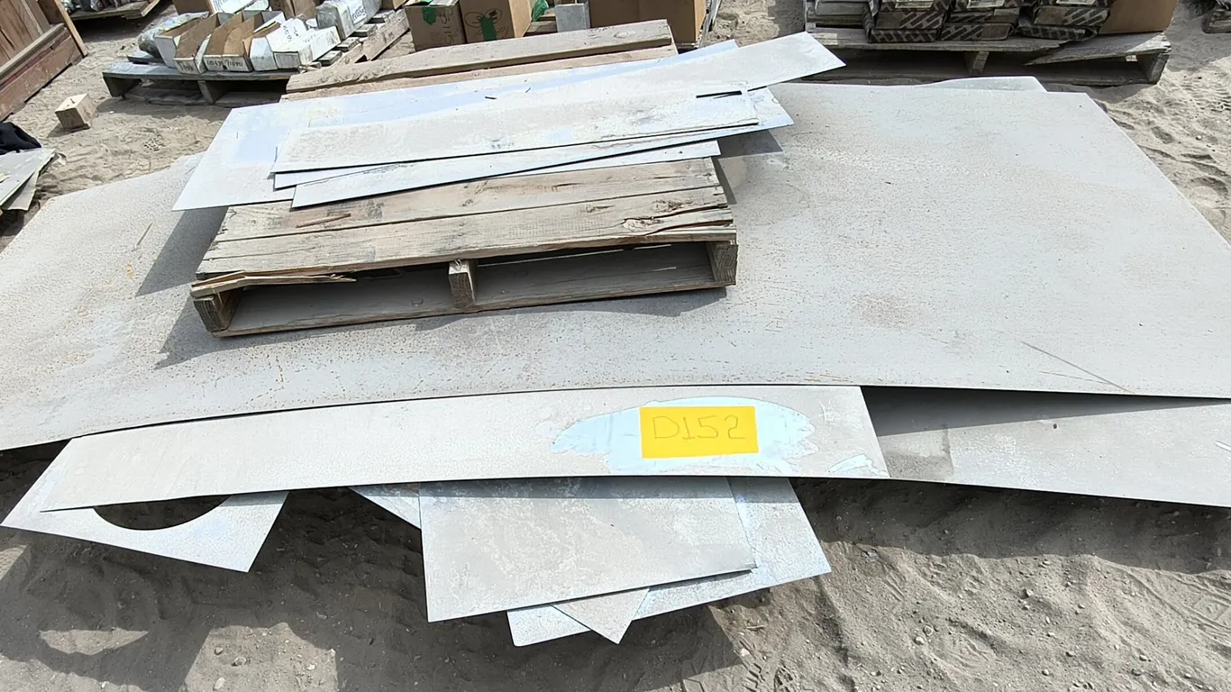 Assorted flat metal sheets and plates of various sizes and thicknesses