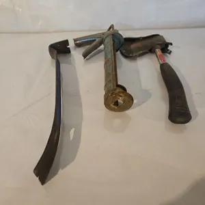 Hatchet, caulking gun & pry bar