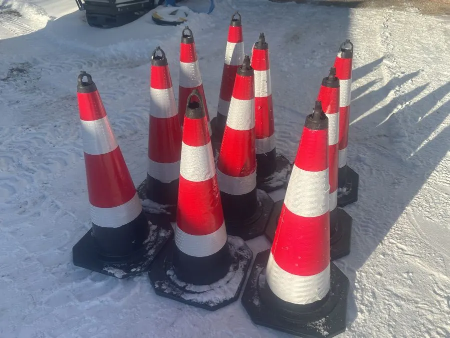 25 new plastic pylons, see lot details. 14"x14" base, 30" high ONLY 10 shown 25 included- file pictures