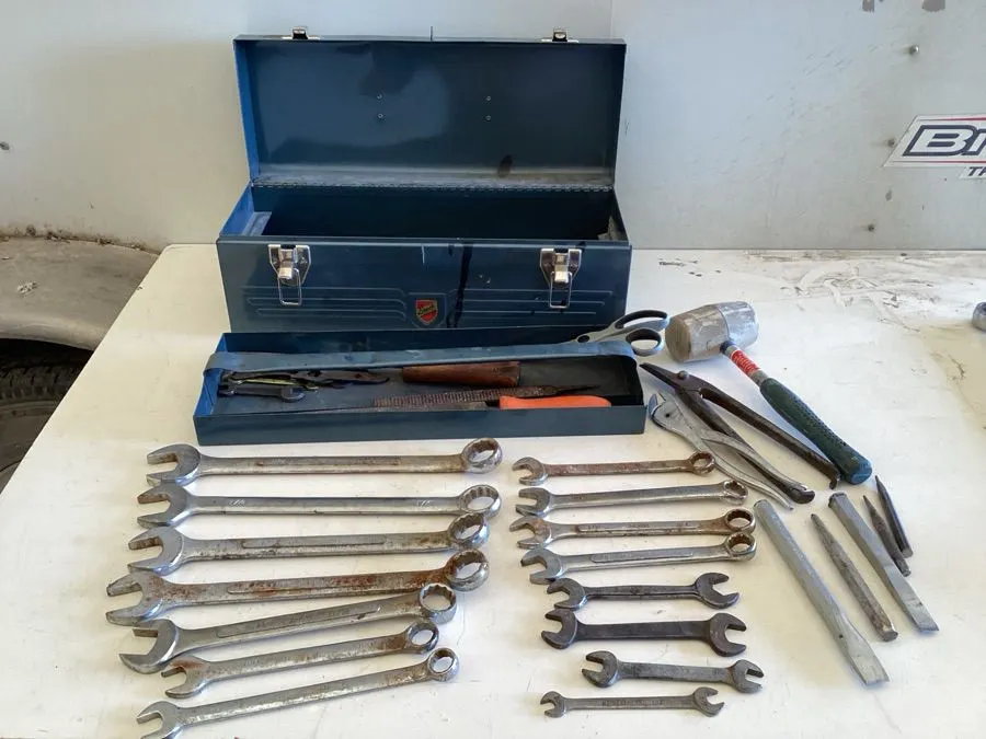 Metal toolbox approximate 19“ x 7“ x 7“, various wrenches up to 1 1/16", rubber mallet, scissors, chisel, etc.
