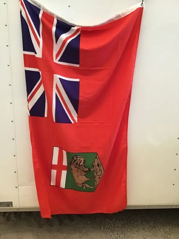 Manitoba flag, 58” x 34”, tiny stain
