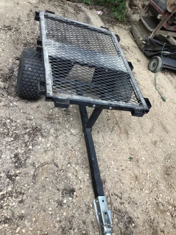 Garden trailer, deck 48” x 34”, tilt, 2" ball hitch, tires need air, condition unknown