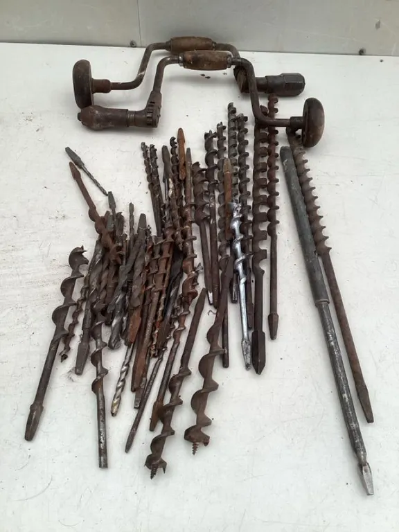 Vintage hand drills and drill bits