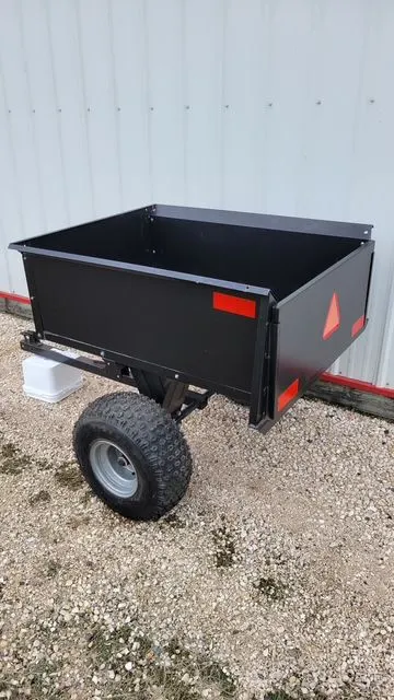 Quad/Garden tractor trailer with tilt box, in like new condition, 42"long x 34" wide x 16" deep.