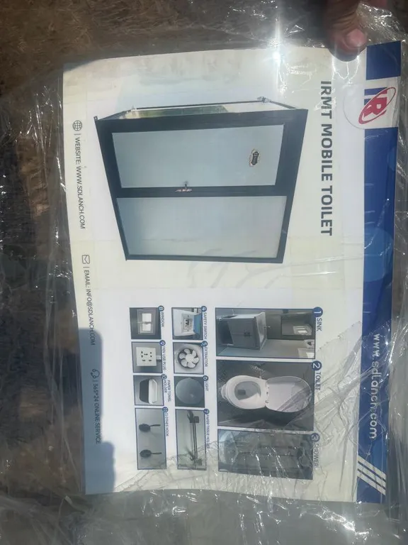Portable toilet with shower, sink, and toilet. Plumbing hook ups and holding tank port included. See description for dimensions and other information.
