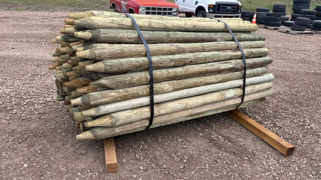 (115) Unused Treated 3"-4" x 7' Posts