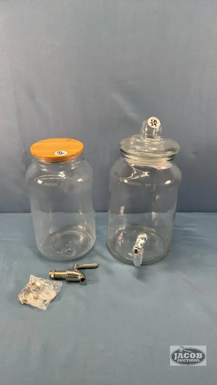 (2) UNMATCHED GLASS DRINK DISPENSERS