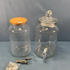 (2) UNMATCHED GLASS DRINK DISPENSERS