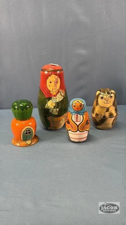 (3) NESTING DOLLS AND (1) EMPTY NESTING DOOL