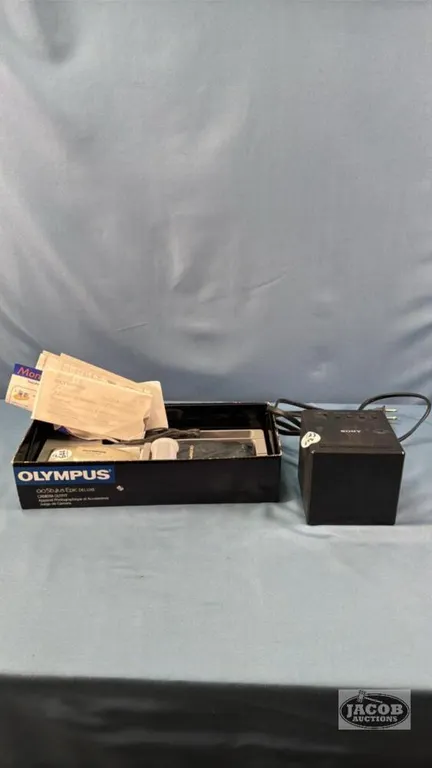 OLYMPUS CAMERA WITH A SONY RADIO ALARM CLOCK