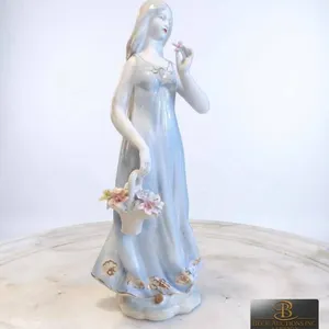 Porcelain Figurine of Woman with Flower Basket