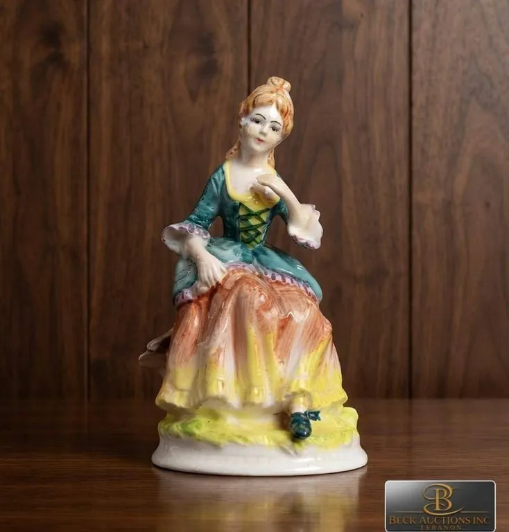 Hand-Painted Porcelain Figurine of Seated Lady