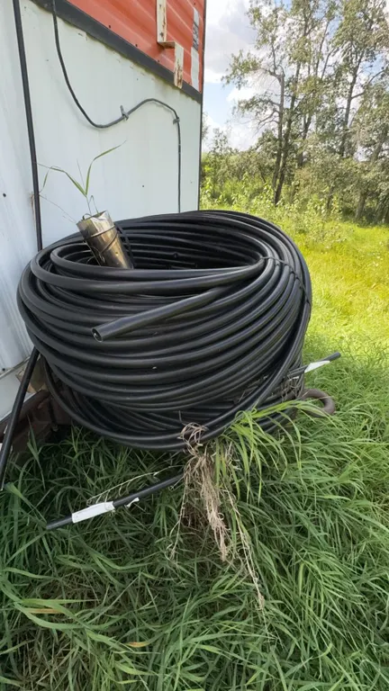 Large Roll of Black Plastic Pipe