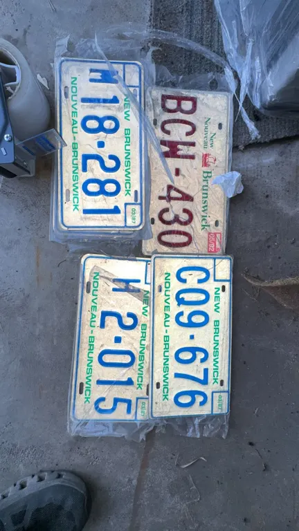 Five Vintage New Brunswick License Plates Assorted Years