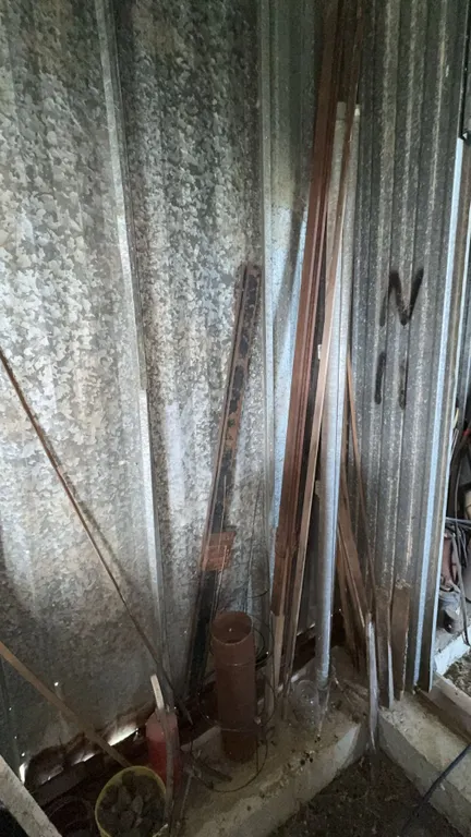 Garage Lot with Tires, Wire, and Metal Items