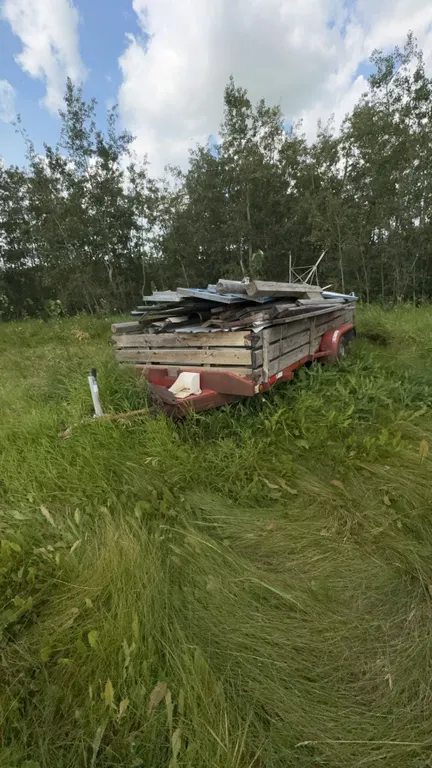 Tandem Axle Utility Trailer With Mixed Metal and Wood Load