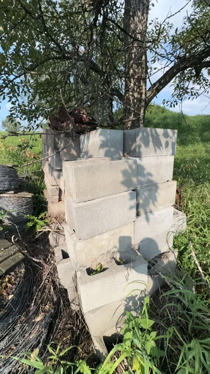 Stack of Assorted Concrete Cinder Blocks