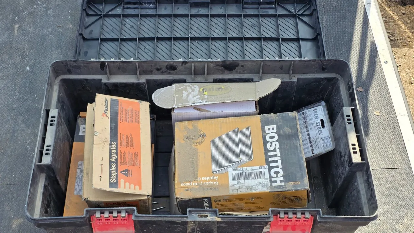 Tool box full of staples and nails