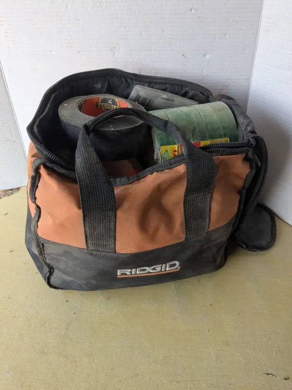 Rigid tool bag full of tape