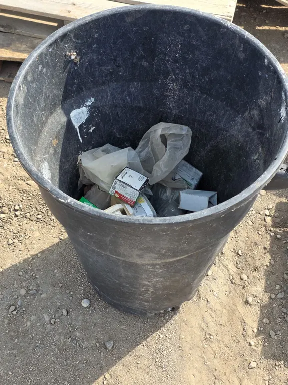 Garbage can full of loose hardware- screws, bolts