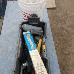Toolbox of misc with bucket of sealant