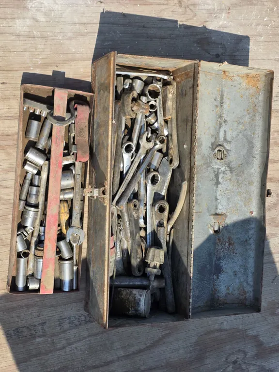 Tool box full of sockets and wrenches