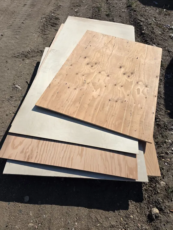 Pallet of varing plywood boards- most are 4ft by 7ft