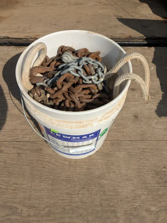 Bucket of tow rope and chains